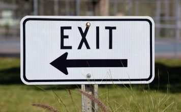 exit sign to represent FTSE quarterly reviewing demoting companies from an index